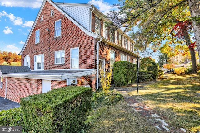 view of property exterior featuring a yard