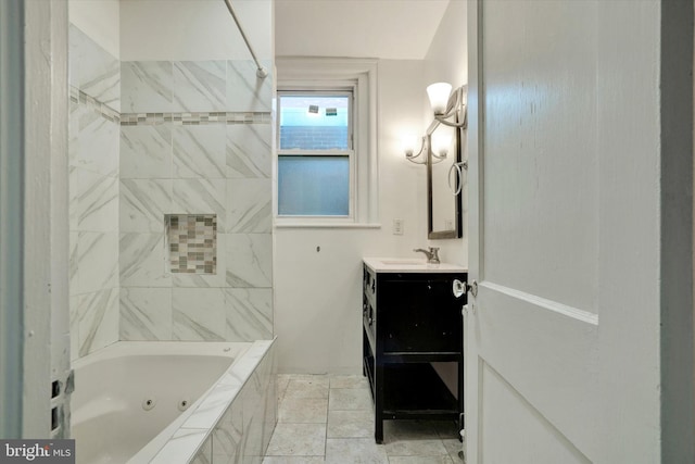 bathroom with tiled shower / bath, vanity, and tile patterned flooring