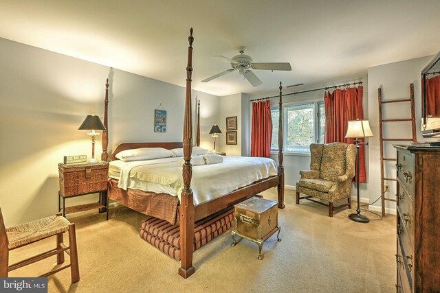 bedroom featuring light colored carpet and ceiling fan