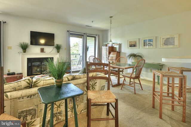 dining room featuring light carpet