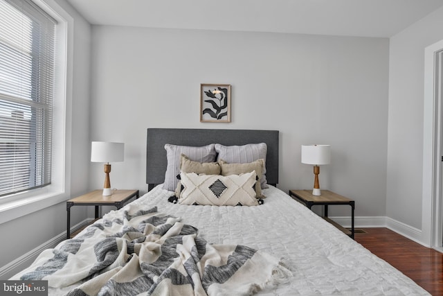 bedroom featuring dark hardwood / wood-style flooring