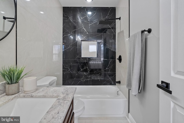 full bathroom with toilet, tiled shower / bath combo, and vanity