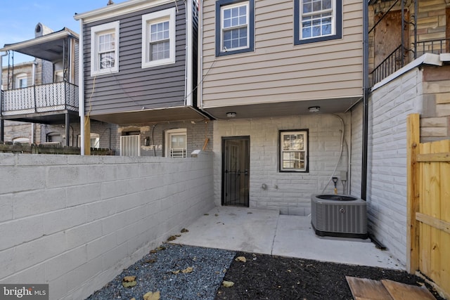 exterior space with a patio area and central AC unit