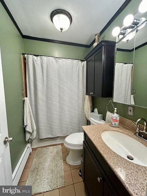 full bathroom featuring toilet, tile patterned flooring, baseboard heating, ornamental molding, and vanity