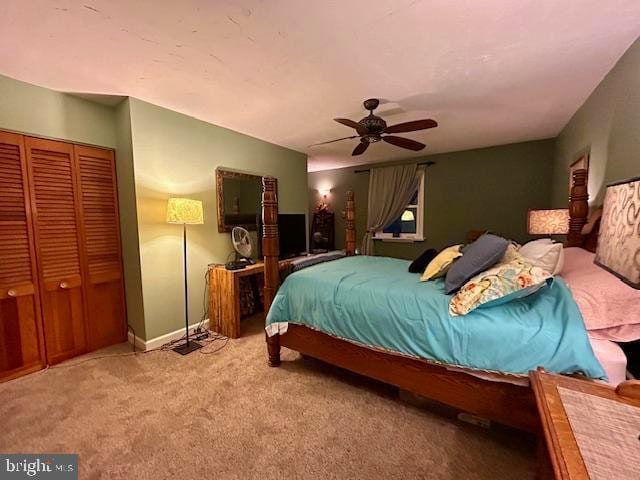 bedroom with a closet, carpet, and ceiling fan