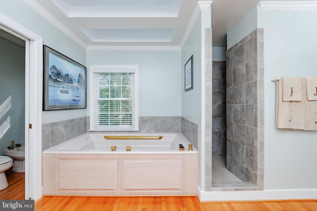 bathroom with separate shower and tub, hardwood / wood-style floors, toilet, ornamental molding, and a bidet