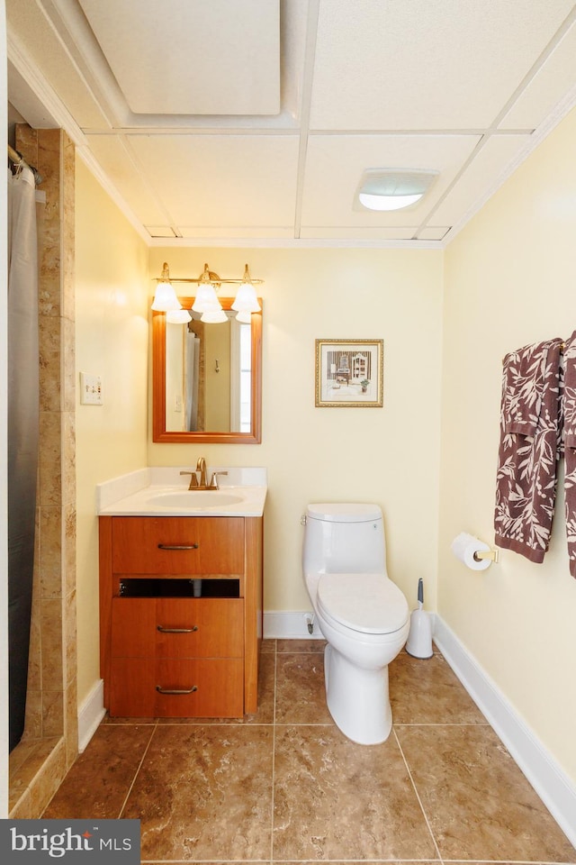 bathroom with vanity, a shower with shower curtain, toilet, and tile patterned flooring