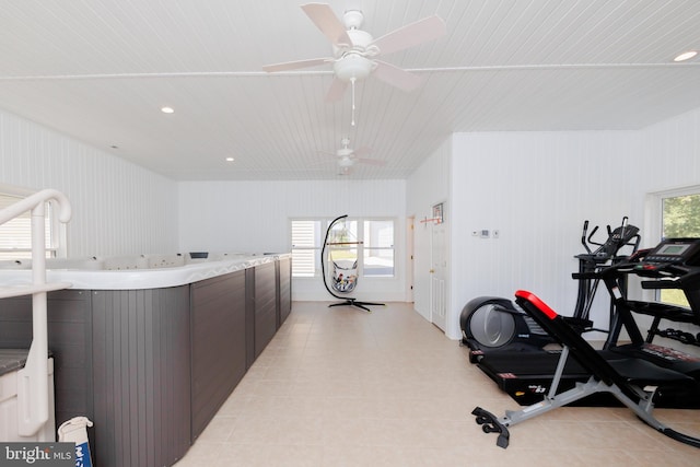 exercise room with a jacuzzi and ceiling fan