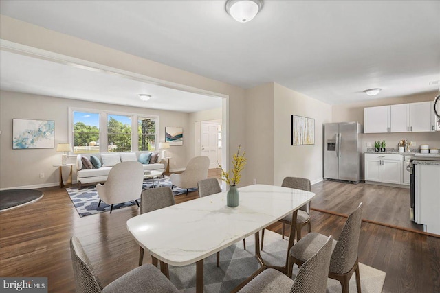 dining room with dark wood-type flooring