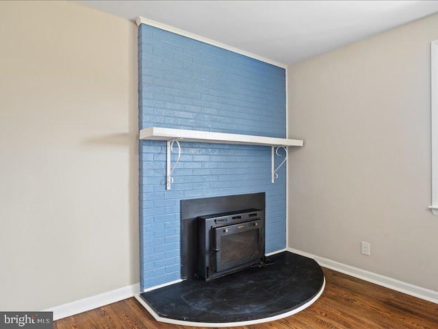 details with wood-type flooring and a wood stove