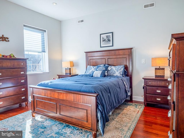 bedroom featuring dark hardwood / wood-style flooring