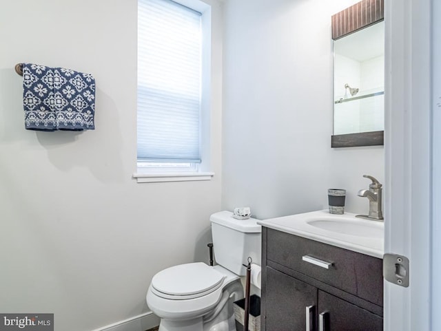 bathroom featuring toilet and vanity