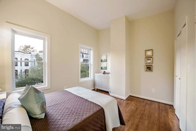 bedroom with hardwood / wood-style flooring