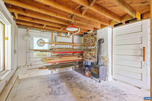 basement featuring a wood stove