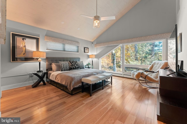 bedroom featuring ceiling fan, high vaulted ceiling, and light hardwood / wood-style flooring