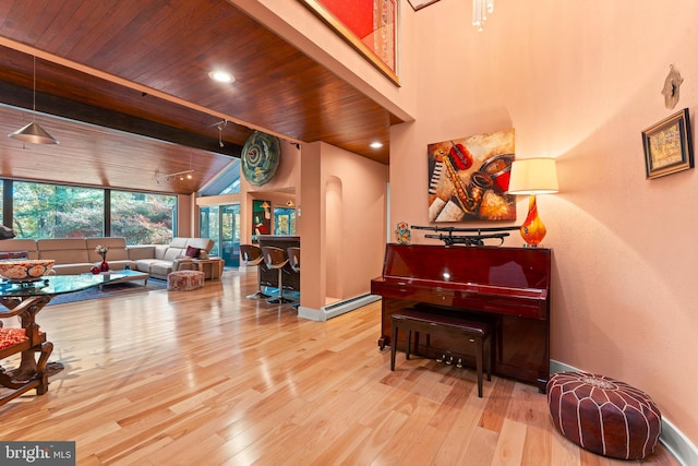 miscellaneous room featuring wood ceiling, wood-type flooring, and beamed ceiling