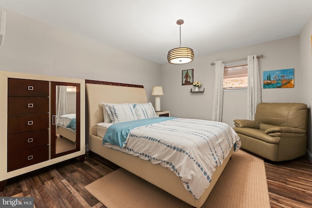 bedroom featuring dark hardwood / wood-style flooring