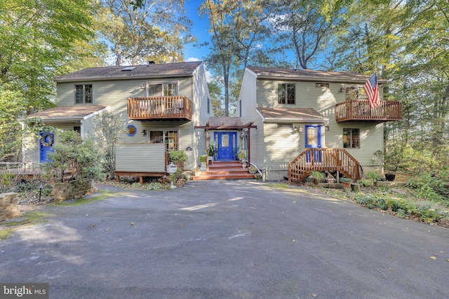 view of front of home featuring a balcony