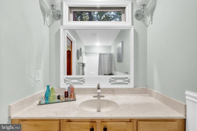 full bath with vanity and a shower with curtain