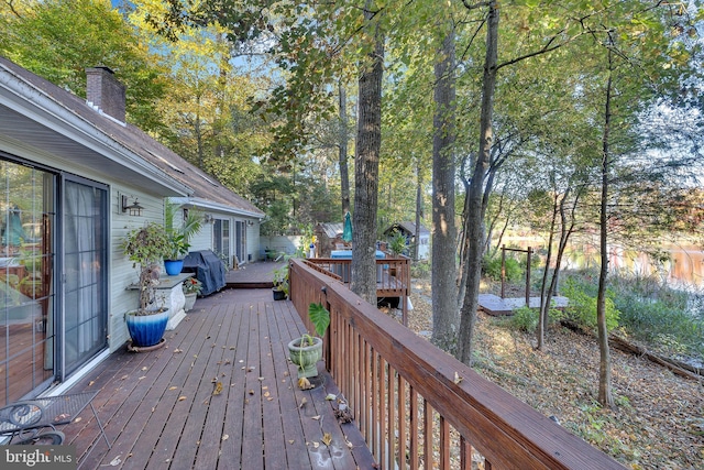 wooden terrace with grilling area