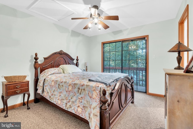 bedroom featuring access to outside, baseboards, light colored carpet, attic access, and ceiling fan