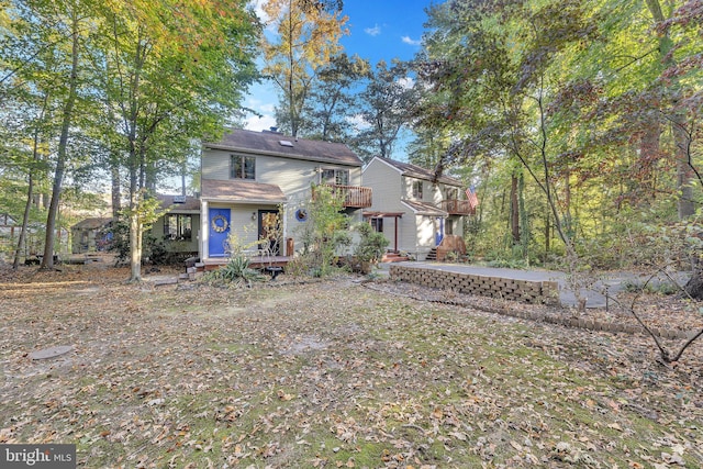 rear view of property with a deck