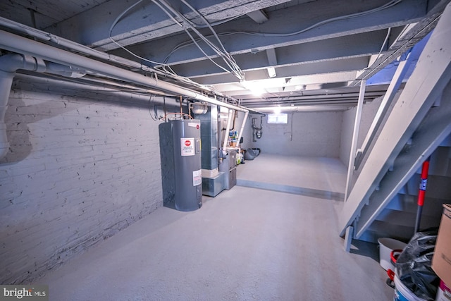 basement with heating unit and electric water heater