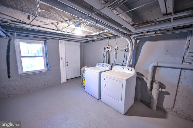 laundry area with independent washer and dryer