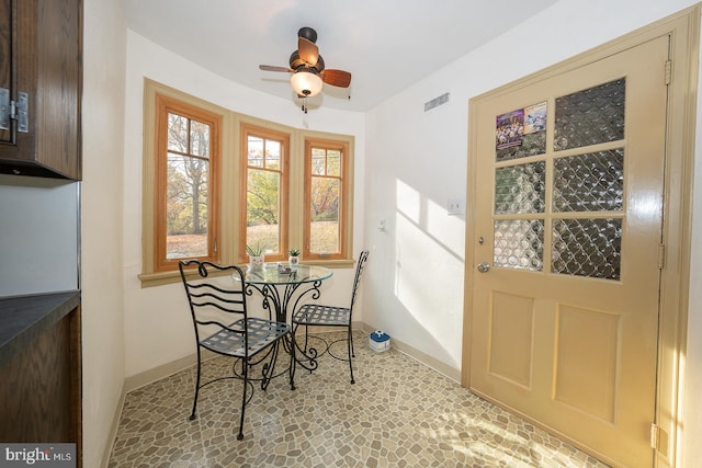 dining space with ceiling fan