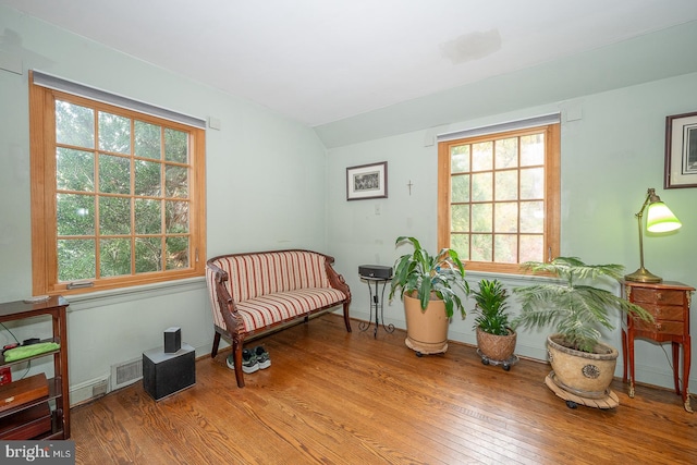 sitting room with light hardwood / wood-style floors and a healthy amount of sunlight