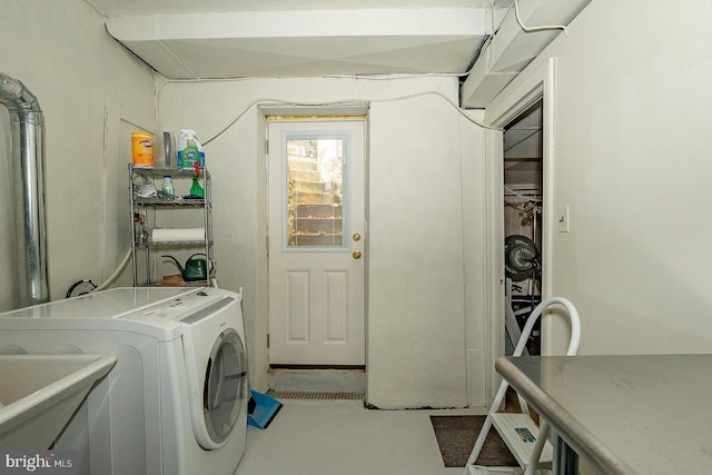 laundry room featuring washer / clothes dryer and sink