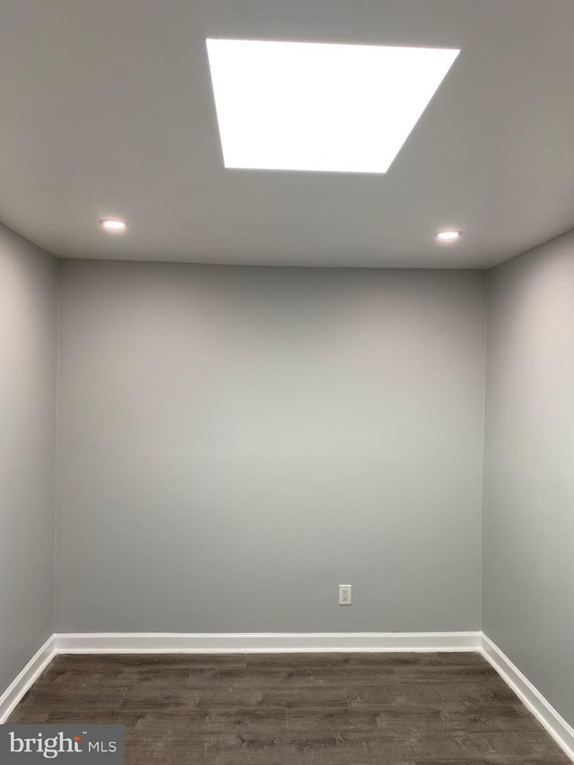 empty room featuring dark hardwood / wood-style flooring