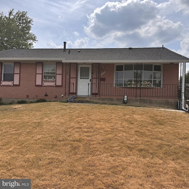 ranch-style house with a front yard