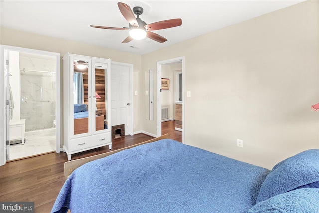 bedroom with dark hardwood / wood-style floors, connected bathroom, and ceiling fan