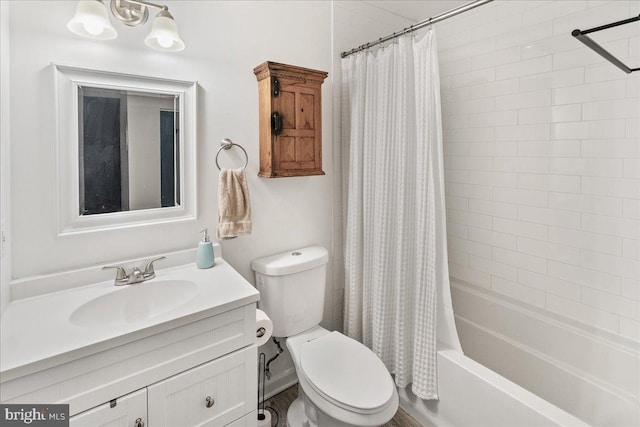 full bathroom featuring vanity, shower / bath combination with curtain, and toilet