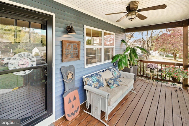 wooden deck with ceiling fan