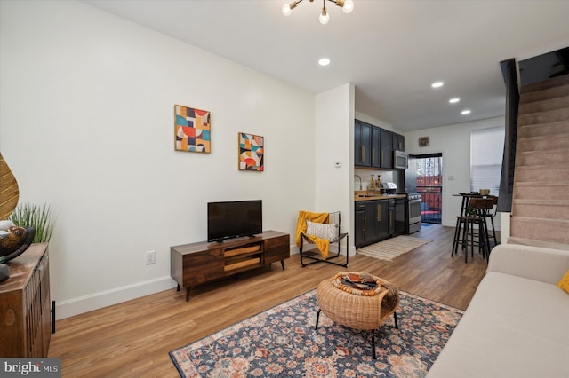 living room featuring sink and hardwood / wood-style flooring