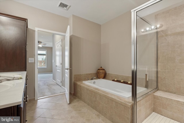 bathroom featuring vanity, ceiling fan, plus walk in shower, and tile patterned flooring