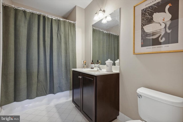 bathroom with vanity, a shower with curtain, toilet, and tile patterned flooring