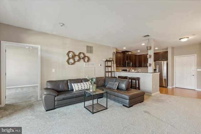 living room with light carpet