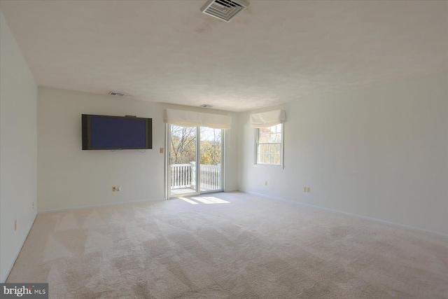 unfurnished room with light colored carpet