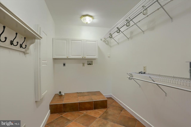 laundry room featuring hookup for a washing machine, cabinets, and hookup for an electric dryer