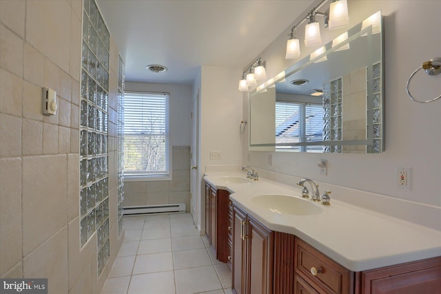 bathroom with a baseboard radiator, tile walls, vanity, a shower, and tile patterned flooring