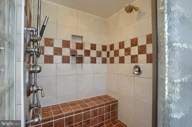 bathroom featuring a tile shower