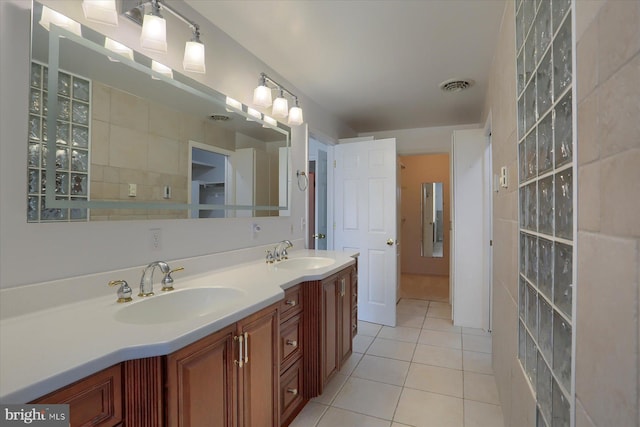 bathroom with vanity and tile patterned flooring