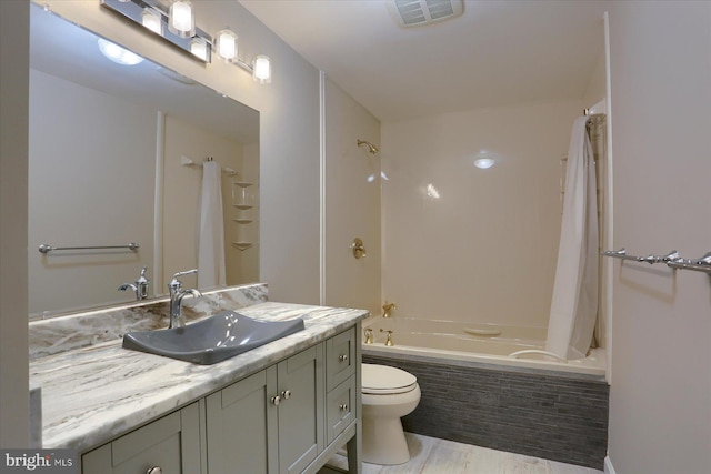 full bathroom featuring vanity, shower / bath combination with curtain, hardwood / wood-style flooring, and toilet