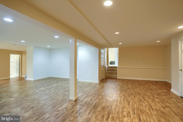 basement featuring hardwood / wood-style flooring