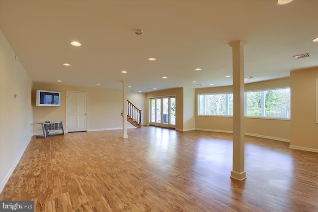 unfurnished living room with light hardwood / wood-style floors