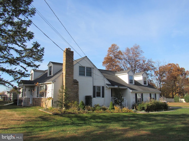 view of side of home featuring a lawn