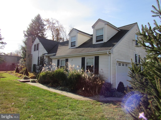 view of front facade with a front yard and a garage